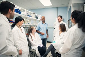 UBC Psychology faculty and students discussing research in the Soma Lab.