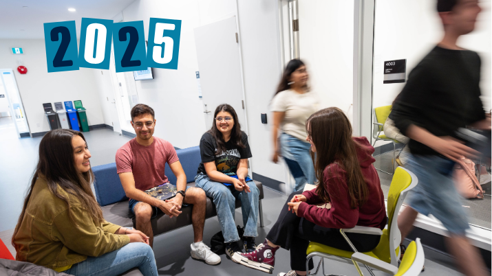 Group of psychology students talking and sitting in the Douglas Kenny Building, with '2025' text overlaid in the top left corner.